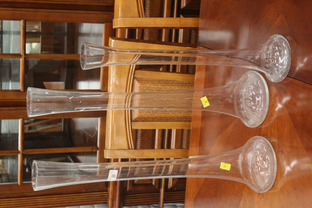 Three tall glass vases,