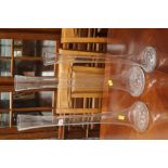 Three tall glass vases,