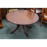 A modern circular occasional table with