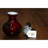Red glass vase marked Rochere and a Paul