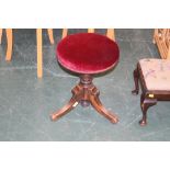 A Victorian piano stool with revolving s