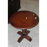 An oak circular occasional table with ca