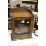 An oak smokers cabinet, 29 cm wide, 40 c