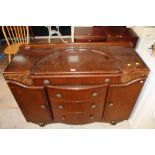 A 1940's oak sideboard with carved mould