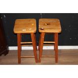 A pair of pine bar or kitchen stools and