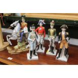 Five figurines in 19th century military uniforms, one mounted, horseman height 31 cm,