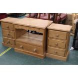 A pair of three drawer pine bedside cabi