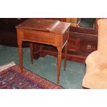 A mahogany sewing machine table with Sin