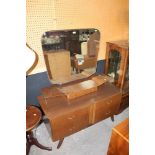 A mid century teak finish dressing table