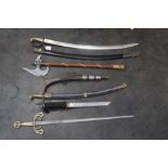 A collection of ornamental swords and pi