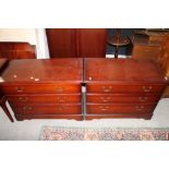 A pair of modern mahogany low chests of