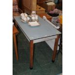 A blue formica topped rectangular table,