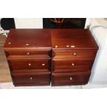 A pair of mahogany laminate bedside ches