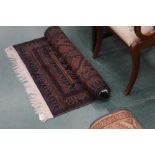 An Afghan Belouch woollen rug, blue and