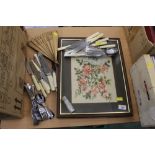 Small framed needlework, fan and cutlery