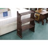 A set of dark oak bookshelves, three tie