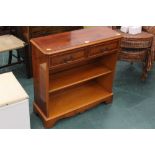 A yew hall table/bookcase with two drawe