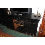 A black painted sideboard with drawers,