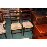 A pair of oak ladderback bedroom chairs,