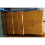 A 1960's light oak cupboard with four dr