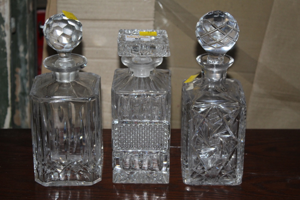 Three cut glass decanters, each of diffe