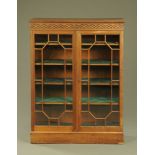 A Late Victorian glazed bookcase,