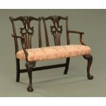 A 19th century mahogany double chair back settee,