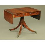 A Regency rosewood sofa table, fitted with two frieze drawers and two opposing dummy drawers,