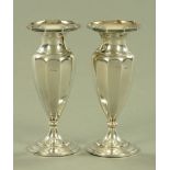 A pair of silver vases, with octagonal top and circular foot, weighted, Birmingham 1921. Height 17.