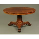 An early Victorian breakfast table, circular with faceted column triform base and scroll feet.