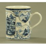 An antique Chinese blue and white tankard,