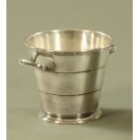 A silver plated ice pail.