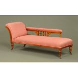 A Victorian oak chaise longue,