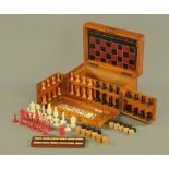 A Victorian games compendium, with hinged top and folding front and fitted with chessmen,