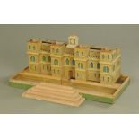 An early 20th century scratch built painted wood model of a castle, Height 34 cm, depth 100 cm,