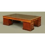 A large late Victorian/ Edwardian mahogany four pedestal partners type desk,