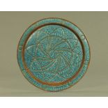 An 18th/19th century Persian Islamic enamelled copper charger. diameter 38 cm.
