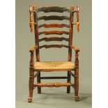 An 19th century wool winder elm ladder back armchair,