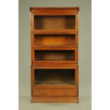 An early 20th century oak sectional bookcase,
