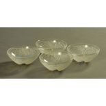 Four Lalique Coquilles small bowls, each etched "R Lalique France". Diameter 13.