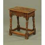 An 18th century oak joint stool, with moulded edge,