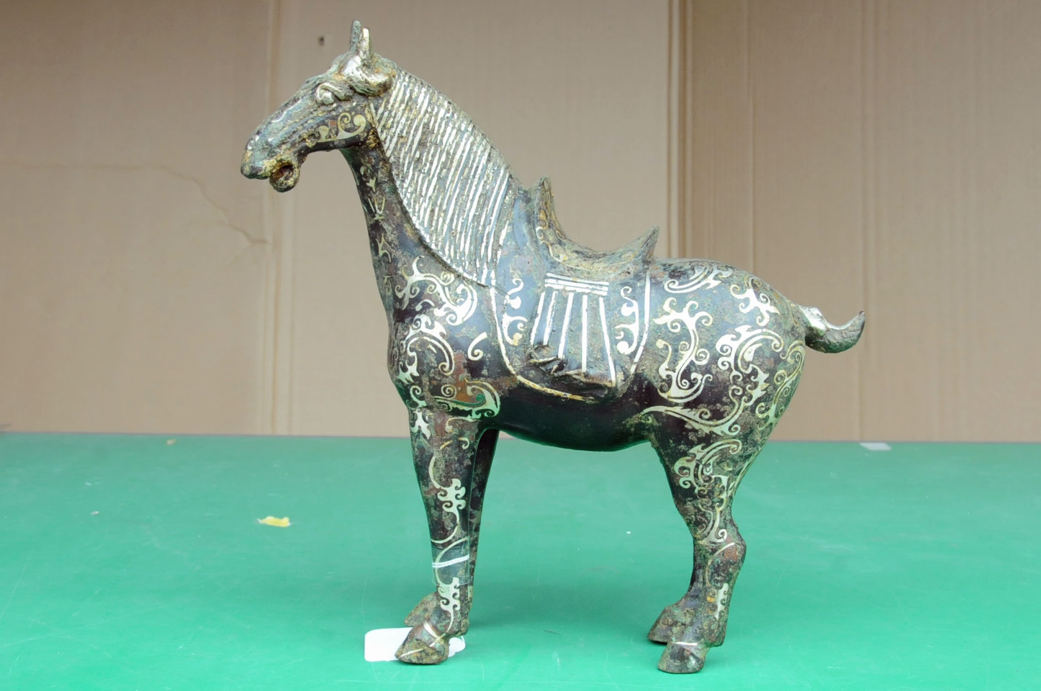 A Chinese bronze figure of a standing horse, with silver coloured metal inlay. Height 29. - Image 2 of 10