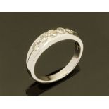An 18 ct white gold five stone half eternity ring, set with diamonds weighing +/- 0.51 ct.