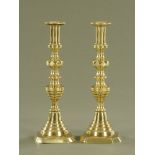A large pair of Victorian polished brass candlesticks. Height 30 cm.
