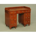 A Victorian military desk, with three quarter gallery,