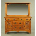 A late Victorian Arts & Crafts oak mirror backed sideboard. Width 153 cm.