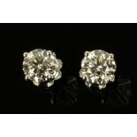 A pair of 18 ct gold stud diamond earrings, diamond weight +/- 1.58 carats, with WGI certificate.