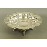 An Edwardian silver bowl, raised on four short cabriole legs, Sheffield 1904, maker Atkin Brothers,