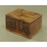 An 18th century oak strongbox, dated 1737, with two locks and plates.
