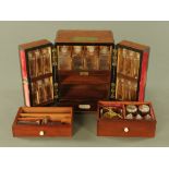 A Victorian mahogany apothecary's travelling case, fitted two drawers and multiple bottle niches,